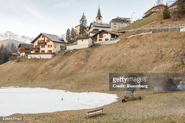 An idled artificial snow cannon, next to a children's training ski slope, in Davos, Switzerland, on Sunday, Jan. 8, 2023. Though its perched at an...