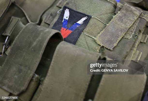 Photograph taken on January 12 shows a Russian military bulletproof vest among equipment and supplies of Russian invaders, seized by Ukrainian forces...