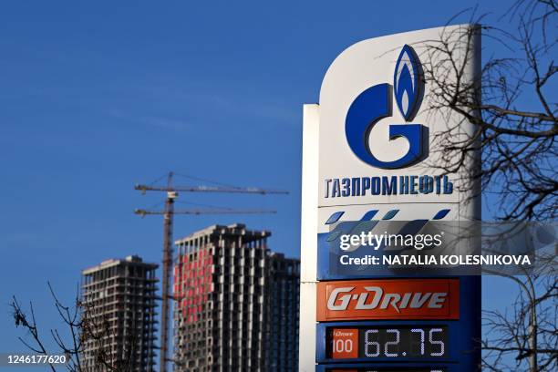 View of a petrol station of the Russian oil producer Gazprom Neft and high-rise residential buildings under construction in Moscow on January 12,...