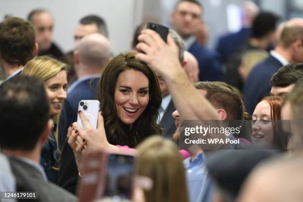 Catherine, Princess of Wales poses for a selfies as she visit the Royal Liverpool University Hospital with Prince William, Prince of Wales on January...