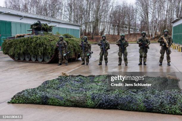 Soldiers of the Bundeswehr's Panzergrenadierbrigade 37 mechanized infantry unit demonstrate the capabilities of the Marder infantry fighting vehicle...