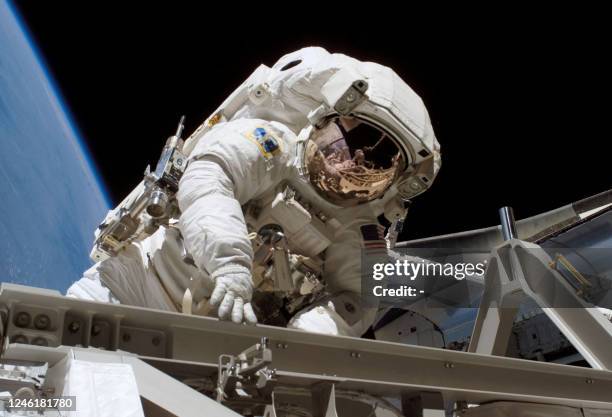 Space shuttle Atlantis Mission Specialist Heidemarie Stefanyshyn-Piper pauses for a photo during work on the newly installed P3/P4 truss assemblies...