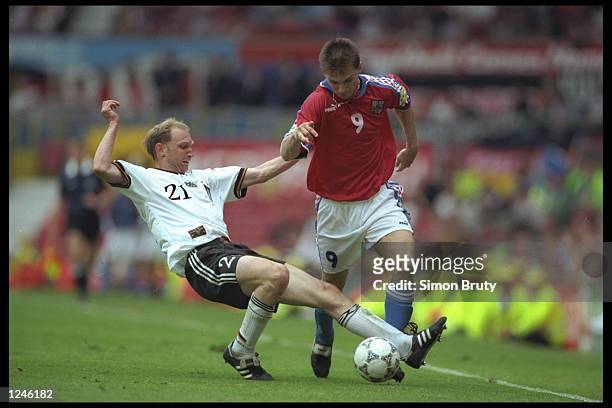 Dieter Eilts of Germany tackles Pavel Kuka of the Czech Republic during the European soccer championship game between Germany and the Czech Republic...
