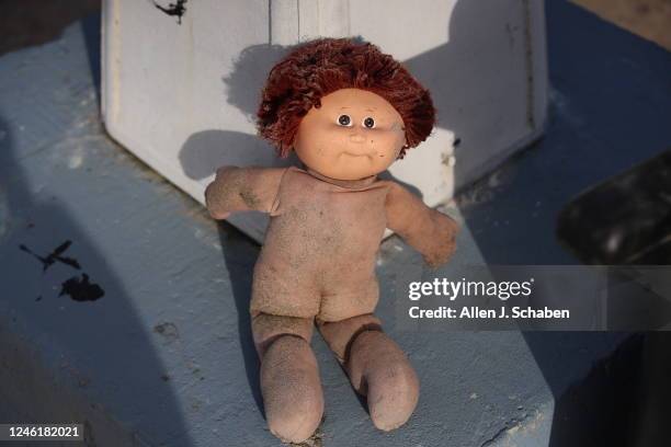Seal Beach, CA A doll is partly covered in sand after recent storms brought large debris-flows and flooding across parts of Seal Beach near the San...