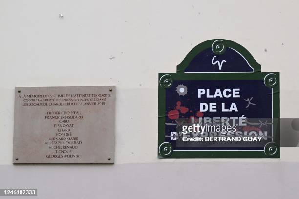 This photograph shows a a plaque in memory of eleven Charlie Hebdo victims of the January 2015 Islamist attacks, near the former office of the weekly...