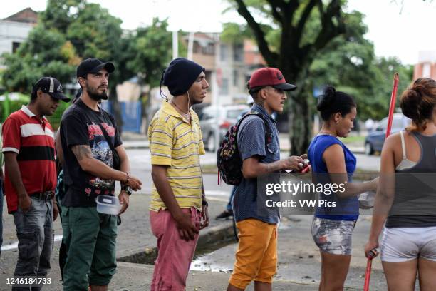 Members of 'Pescador de Hombres' foundation bring food to Venezuelans stranded in a makeshift camp amid Covid-19 pandemic, waiting for an opportunity...