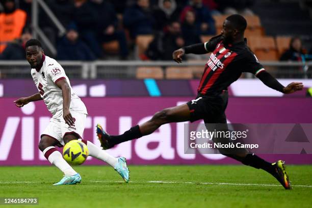 Brian Bayeye of Torino FC provides an assist for Michel Adopo of Torino FC to score a goal during the Coppa Italia football match between AC Milan...