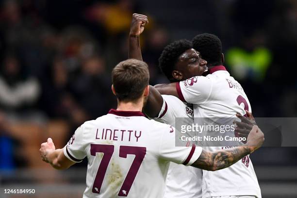 Michel Adopo of Torino FC celebrates with Brian Bayeye and Karol Linetty of Torino FC after scoring a goal during the Coppa Italia football match...