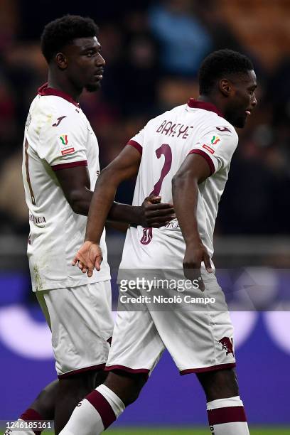 Michel Adopo of Torino FC celebrates with Brian Bayeye of Torino FC after scoring a goal during the Coppa Italia football match between AC Milan and...