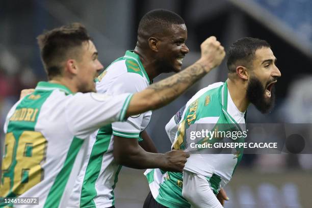 Real Betis' French midfielder Nabil Fekir celebrates scoring the equalizing goal during the Spanish Super Cup semi-final football match between Real...