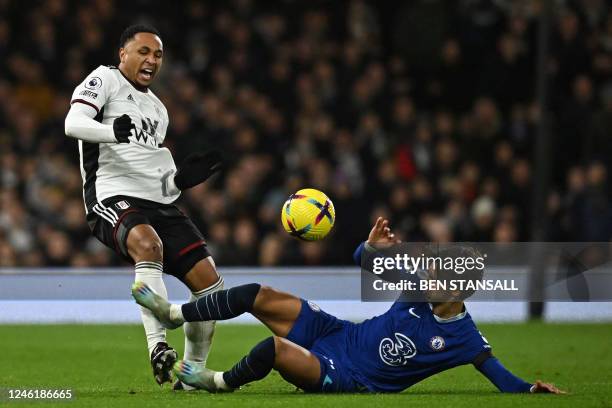 Chelsea's Portuguese striker Joao Felix is sent off for this tackle on Fulham's Dutch defender Kenny Tete during the English Premier League football...