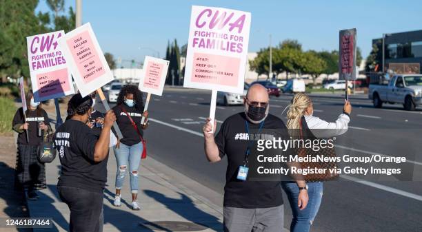 Employees at the AT&T call center picket outside the facility on Edinger Ave. In Tustin, CA on Monday, November 16, 2020. About 30 employees...