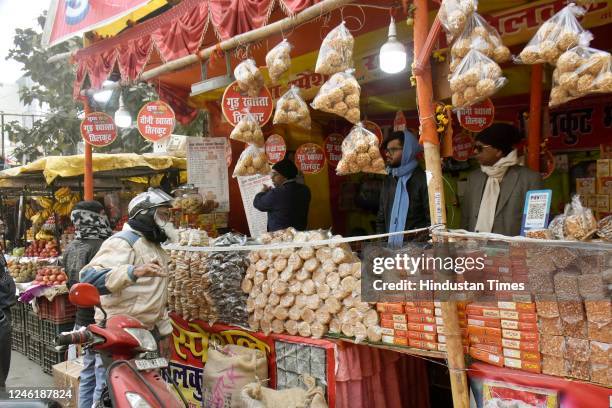 People purchasing Tilkuts ahead of Makar Sankranti festival at a shop at Kadam Kuan on January 12, 2023 in New Delhi, India.