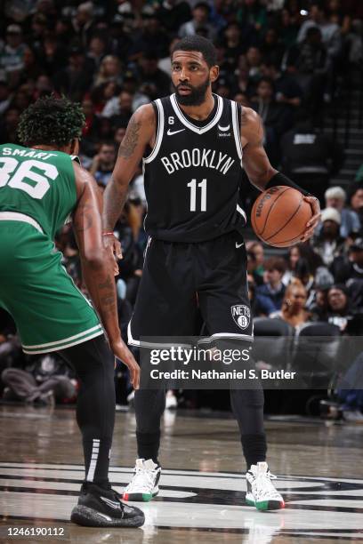 Kyrie Irving of the Brooklyn Nets moves the ball during the game against the Boston Celtics on January 12, 2023 at Barclays Center in Brooklyn, New...