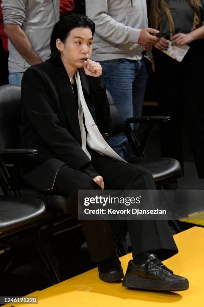 Suga, a member of the South Korean band BTS, attends the Los Angeles Lakers and Dallas Mavericks game at Crypto.com Arena on January 12, 2023 in Los...