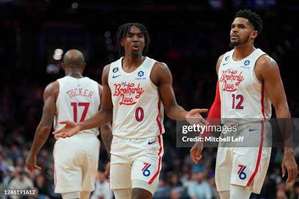 Tyrese Maxey and Tobias Harris of the Philadelphia 76ers react against the Oklahoma City Thunder in the first quarter at the Wells Fargo Center on...