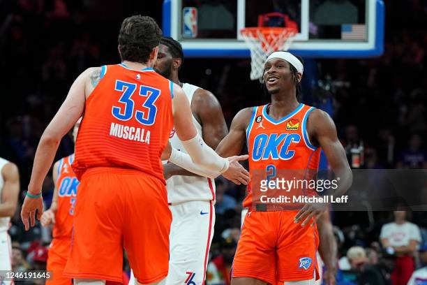 Mike Muscala of the Oklahoma City Thunder celebrates with Shai Gilgeous-Alexander against the Philadelphia 76ers in the fourth quarter at the Wells...