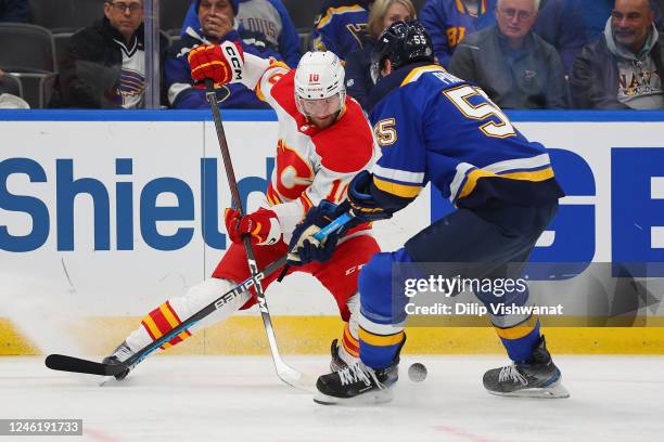 Jonathan Huberdeau of the Calgary Flames controls the puck against the St. Louis Blues in the second period at Enterprise Center on January 12, 2023...