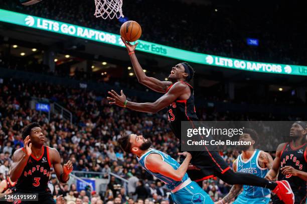 Pascal Siakam of the Toronto Raptors drives to the net against Cody Martin of the Charlotte Hornets during the second half at Scotiabank Arena on...