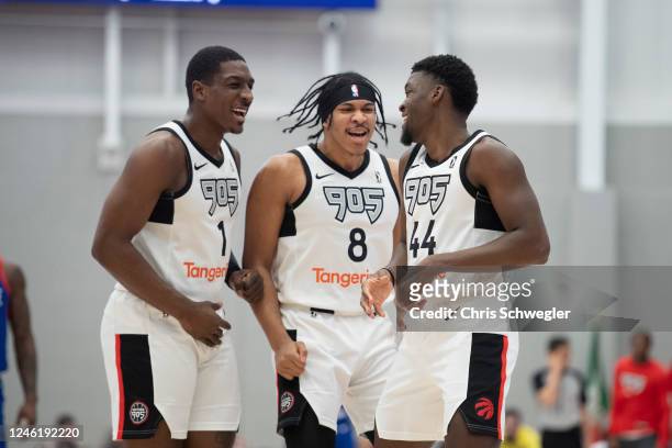 Reggie Perry, Ron Harper and Gabe Brown of the Raptors 905 celebrate a play during the first quarter of the game against the Motor City Cruise on...