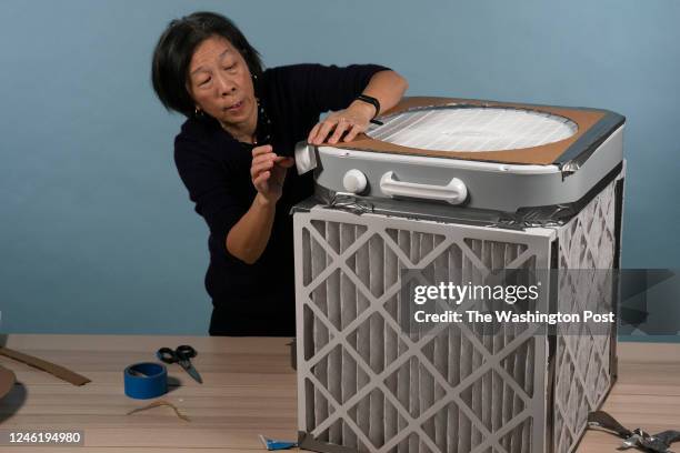 Washington Post health reporter Lena Sun shows the steps in making a do-it-yourself box fan air filter, also known as the Corsi-Rosenthal Box, on...