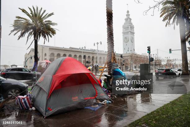 Homeless tents are seen along Embarcadero Street during heavy rain in San Francisco on January 11, 2023 as atmospheric river storms hit California,...