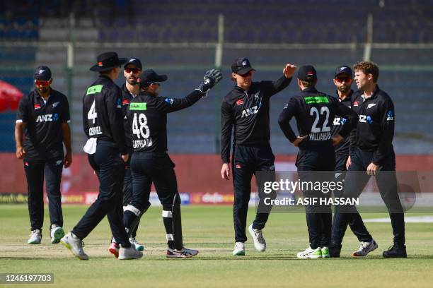 New Zealand's players celebrate after the dismissal of Pakistan's Shan Masood during the third and final one-day international cricket match between...