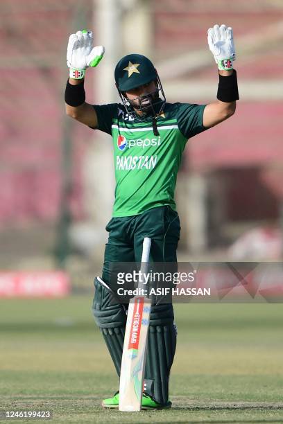 Pakistan's Mohammad Rizwan celebrates after scoring half century during the third and final one-day international cricket match between Pakistan and...