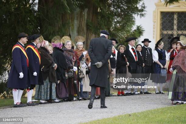 January 2023, Baden-Wuerttemberg, Salem: Guests in traditional costumes stand guard at the second funeral service for Max Margrave of Baden. The...