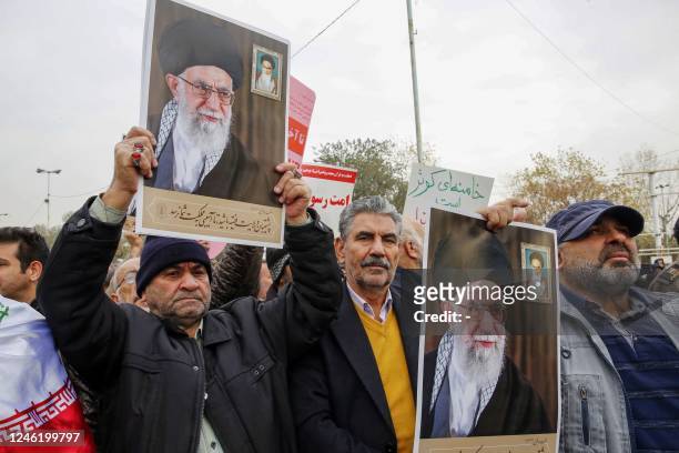 Iranians lift pictures of Iran's Supreme Leader Ayatollah Ali Khamenei during an anti-France rally, in reaction to cartoons depicting Khamenei...