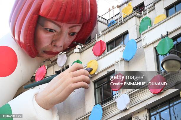This photo taken on January 13 shows a large inflatable mannequin depicting Japanese contemporary artists Yayoi Kusama decorating the French luxury...