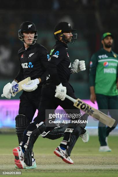 New Zealand's Finn Allen and teammate Devon Conway run between the wickets during the third and final one-day international cricket match between...