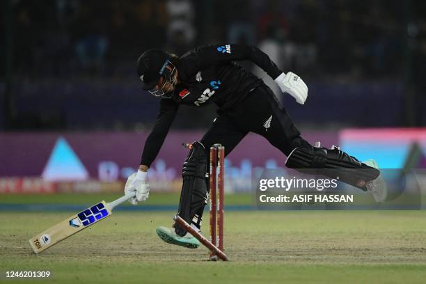 New Zealand's Finn Allen runs out during the third and final one-day international cricket match between Pakistan and New Zealand at the National...