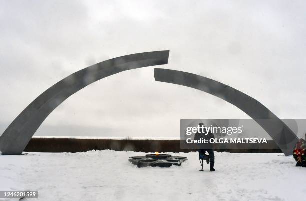 Man visits the monument "Broken Ring" dedicated to breaking of Nazi's siege of Leningrad on the shore of Lake Ladoga in the Leningrad region on...