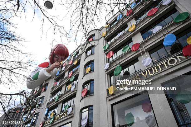 This photo taken on January 13 shows a large inflatable mannequin depicting Japanese contemporary artists Yayoi Kusama decorating the French luxury...