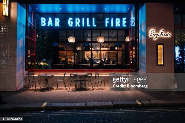 Empty tables outside Sophie's restaurant in the Soho district of London, UK, on Thursday, Jan. 12, 2023. Britain's pubs and restaurants are cutting...