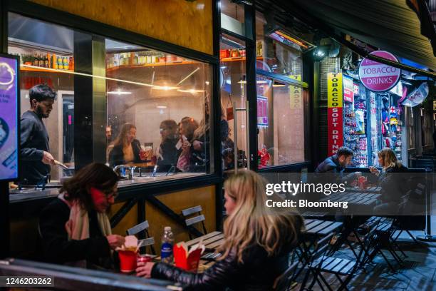 Customers dine at tables outside a restaurant near Leicester Square in London, UK, on Thursday, Jan. 12, 2023. Britain's pubs and restaurants are...