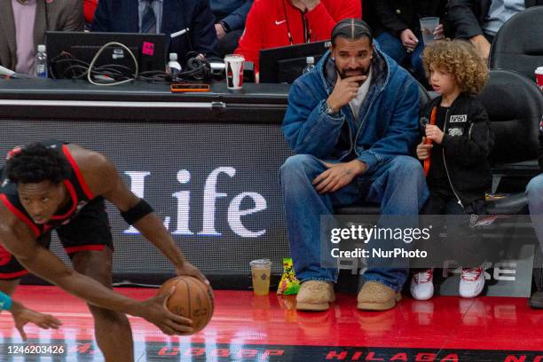 January 12, 2023: Aubrey Drake Graham a Canadian rapper and singer watches at the court during the Toronto Raptors v Charlotte Hornets NBA regular...