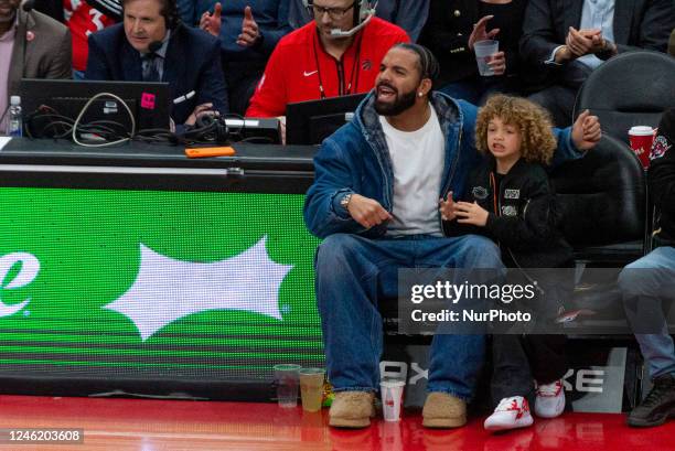 January 12, 2023: Aubrey Drake Graham a Canadian rapper and singer watches at the court during the Toronto Raptors v Charlotte Hornets NBA regular...