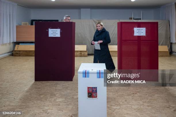 Presidential candidate Danuse Nerudova and her husband Robert Neruda prepare to cast their ballots at the polling station in Kurim, 10 km north of...