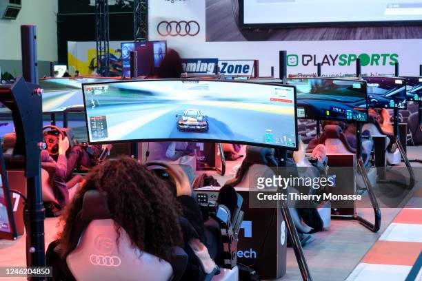 Visitors enjoy the E-Gaming zone during the press opening of the 100th edition of the Brussels Motor Show, in the Heysel Park, on Friday January 13...
