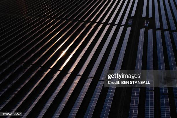 An aerial view shows the photovoltaic solar panels making up the Great Wilbraham Solar Park, near Fulbourn, east of Cambridge in Eastern England on...