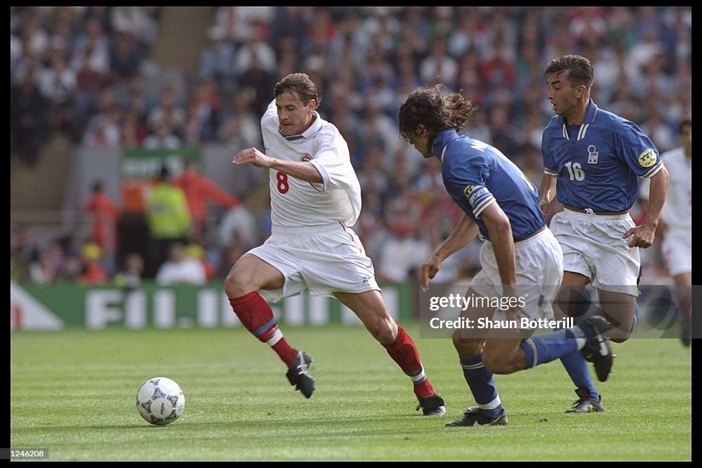 Andrei Kanchelskis of Russia (number 8) is chased by Paolo Maldini of Italy (number 3)