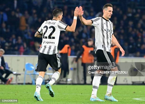 Juventus' Argentinian forward Angel Di Maria celebrates with Juventus' Polish forward Arkadiusz Milik after scoring a goal during the Italian Serie A...