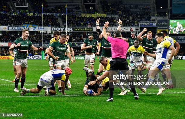 Leicester's English centre Dan Kelly dives across the line to score a try during the European Rugby Champions Cup pool B rugby union match between...