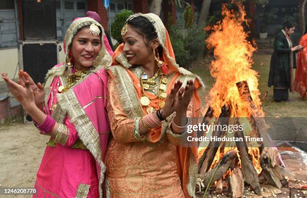 Students perform Gidha during celebration Lohri festival at Shahzada Nand College on January 13, 2023 in Amritsar, India. Lohri is a popular harvest...