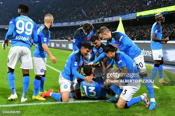 Napoli's Kosovan defender Amir Rrahmani celebrates with team mates after scoring a goal during the Italian Serie A football match between Napoli and...