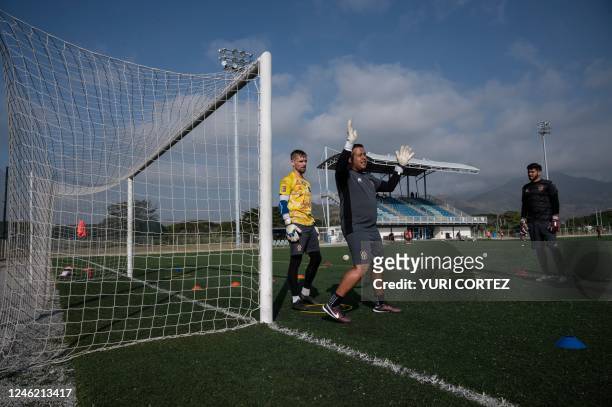 French goalkeeper Jeremy Vachoux , recently signed by the Carabobo Futbol Club team, listens to instructions from the goalkeeping coach Ederson...