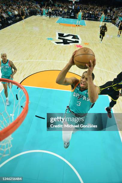 Keldon Johnson of the San Antonio Spurs drives to the basket during the game against the Golden State Warriors on January 13, 2023 at the Alamodome...