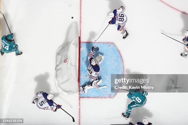 An overhead view as Jack Campbell of the Edmonton Oilers makes a save against Tomas Hertl of the San Jose Sharks at SAP Center on January 13, 2023 in...
